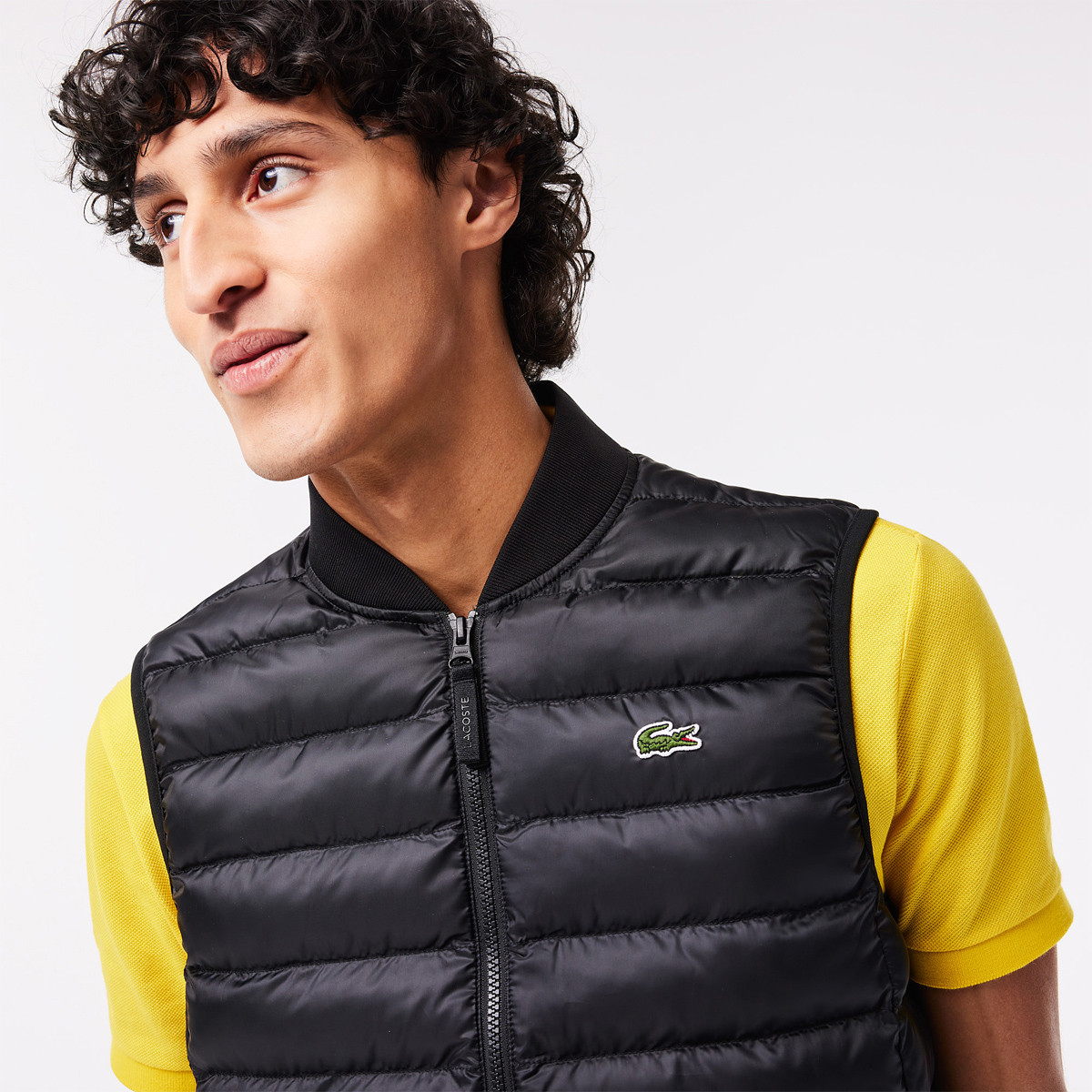 Piumino smanicato on sale lacoste